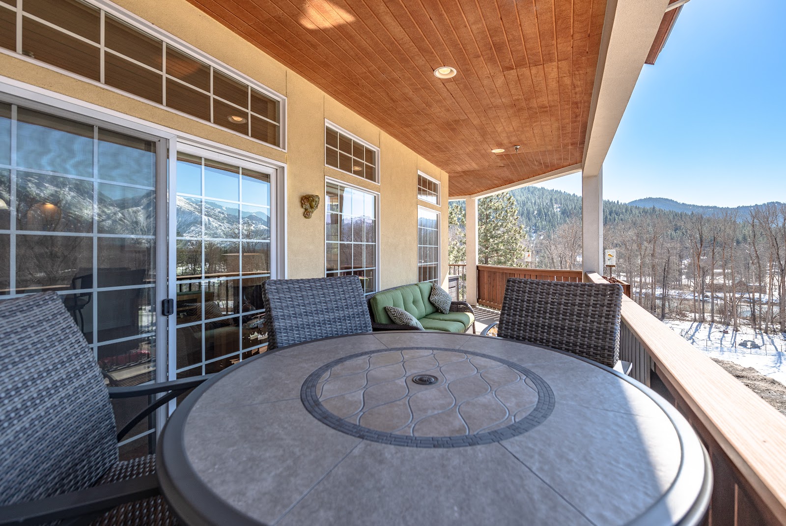 Wrap-around deck with Cascade Mountain views at Raven's Nest