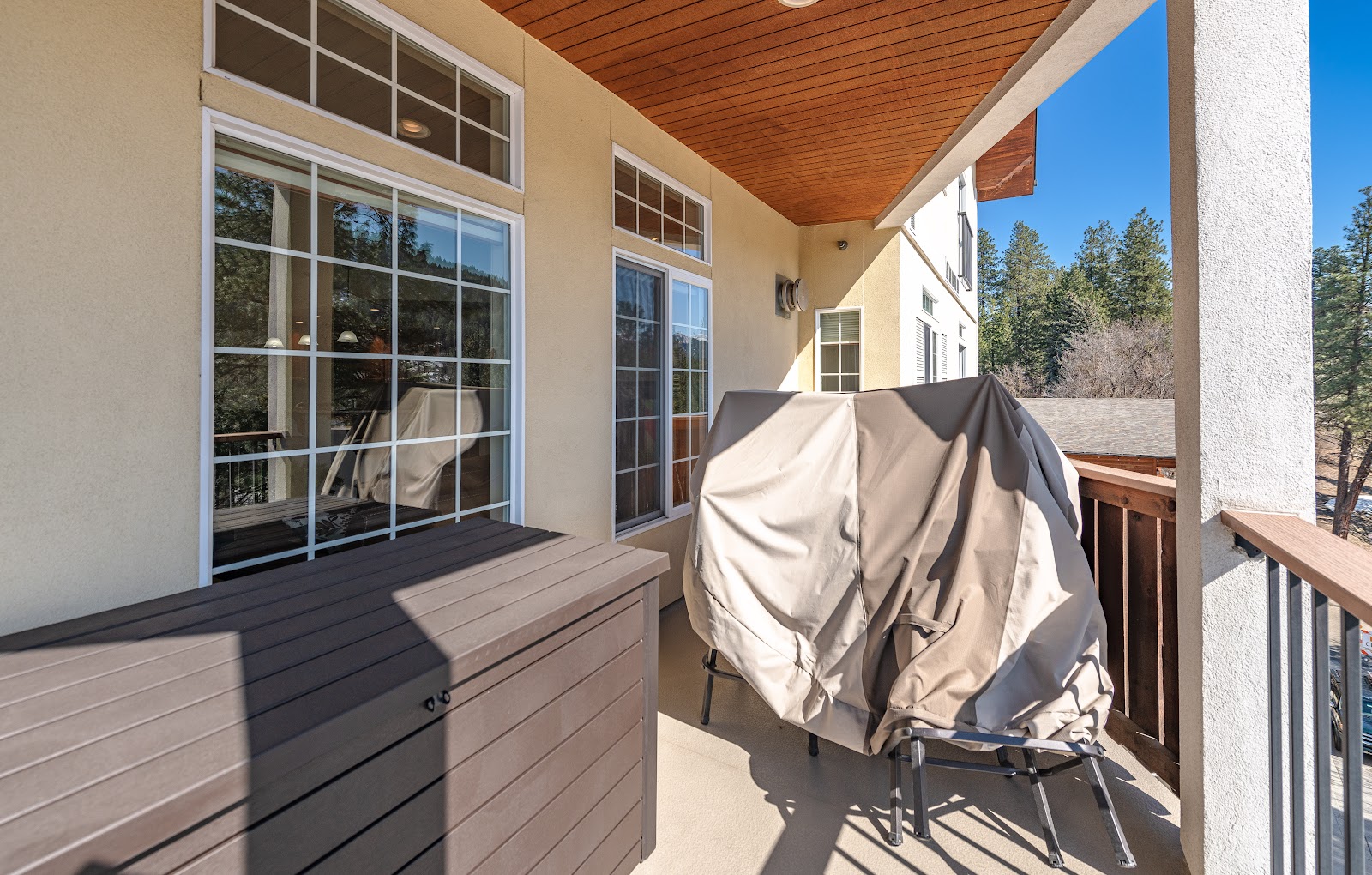 Wrap-around deck under the covered roofline